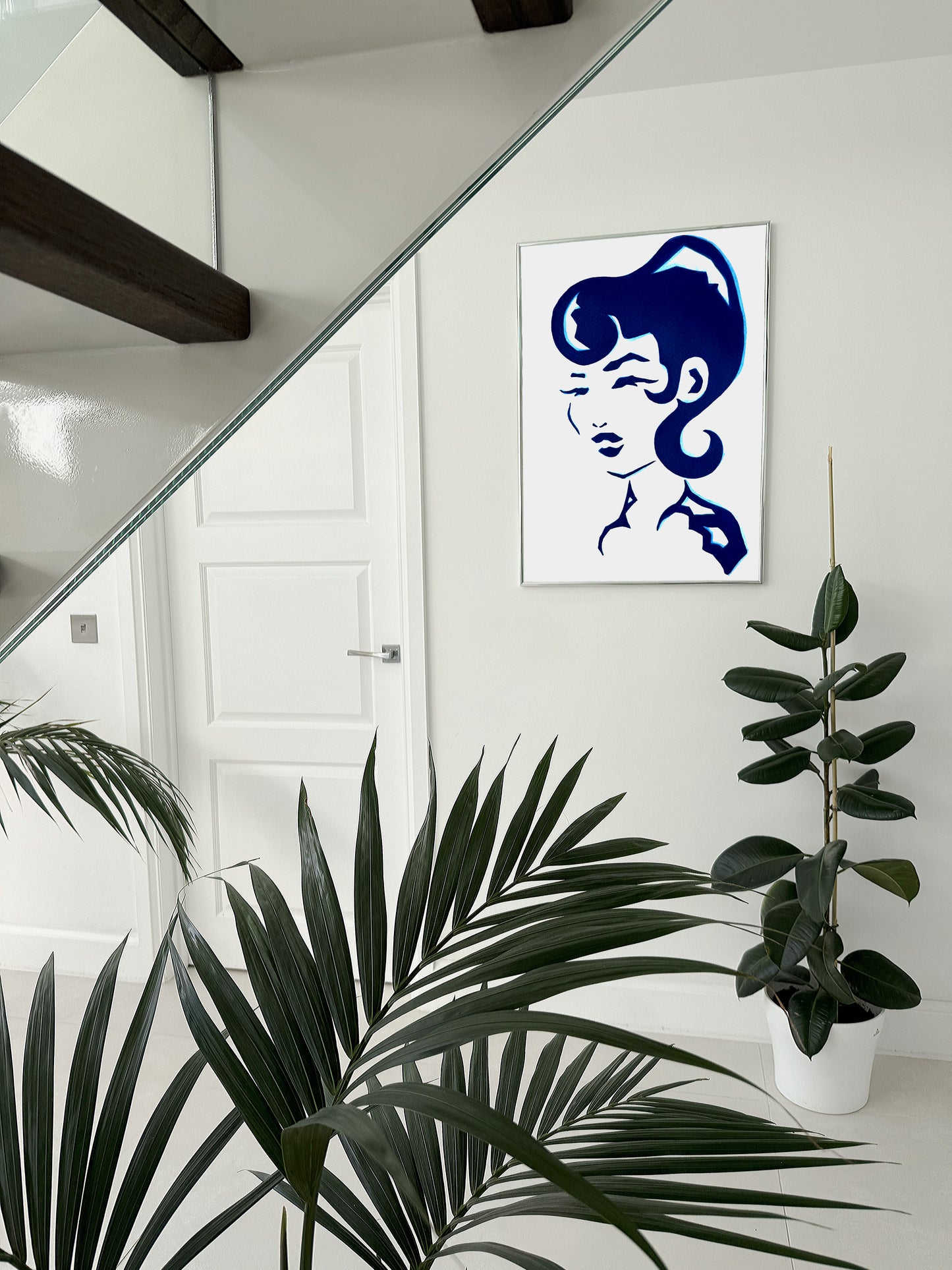 Modern abstract blue acrylic artwork of a woman head. 