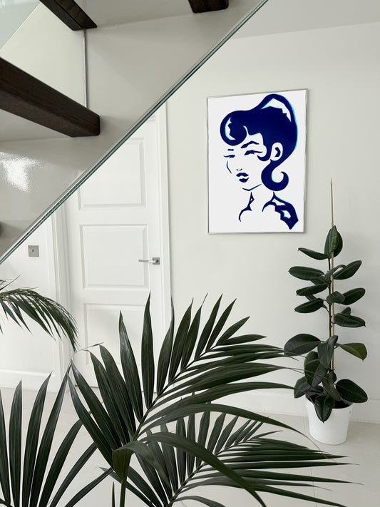 Modern abstract blue acrylic artwork of a woman head. 